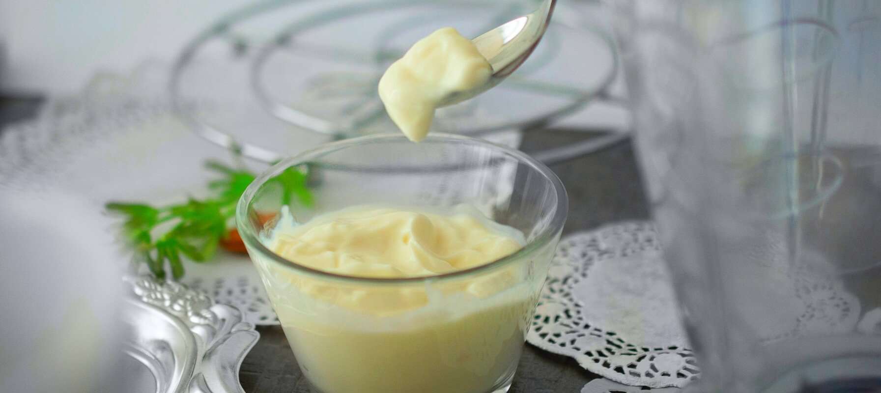 homemade mayonnaise in glass cup on spoon profamilychef