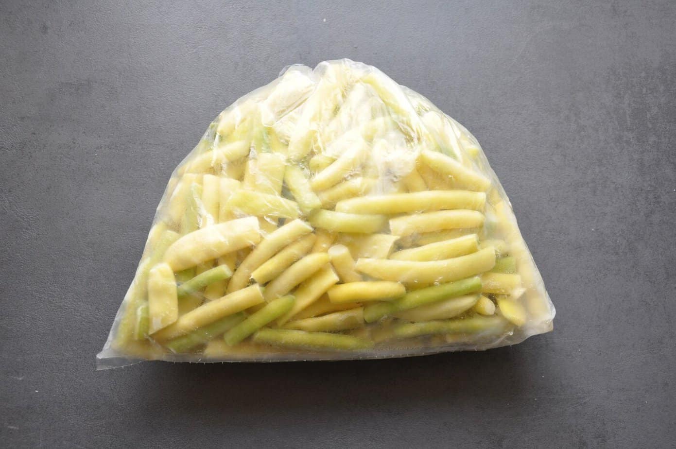Frozen yellow wax beans in a plastic storage bag