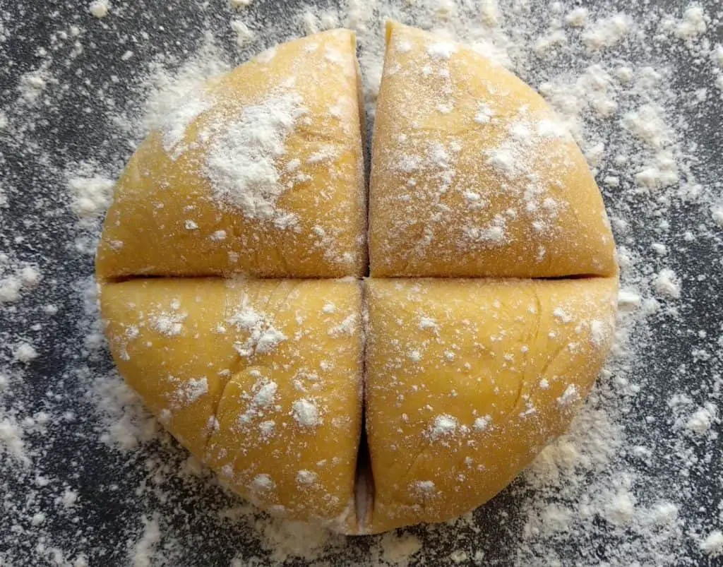 homemade fresh pasta dough cut into pieces