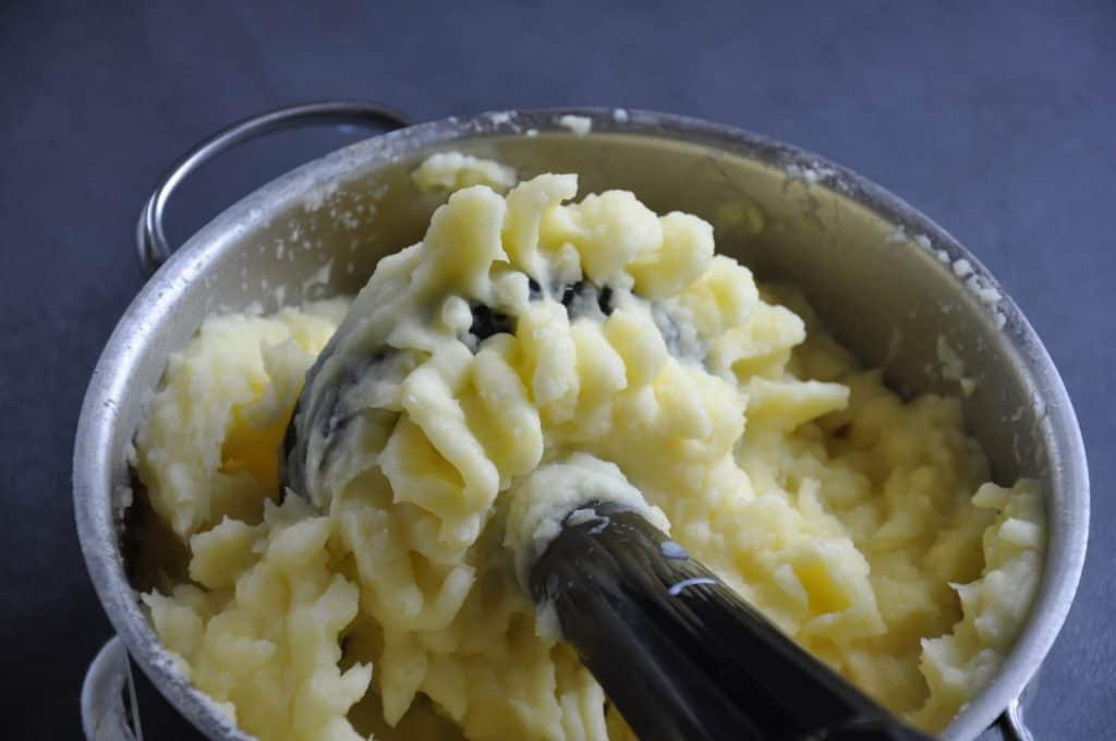 mashed potatoes with potato masher