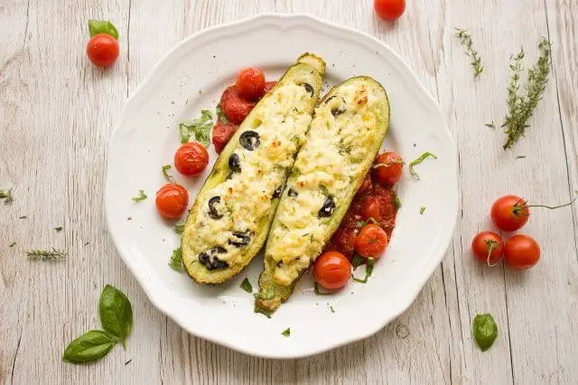 Stuffed overgrown zucchini or courgette with meat rice and parmesan