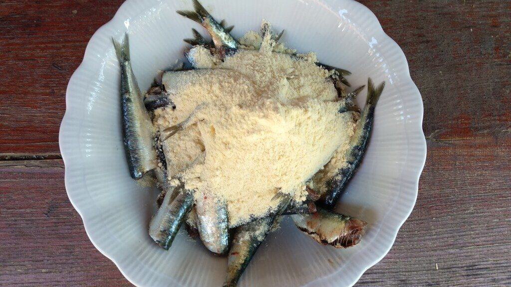 fresh sardines and herring cleaned added corn flour