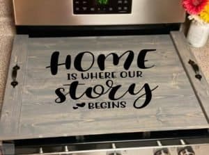 noodle board stove top cover saying home is where our story begins