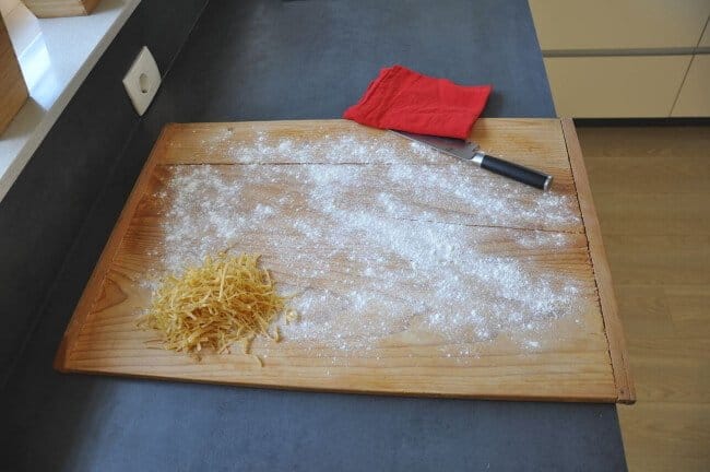 pasta board in use on a counter