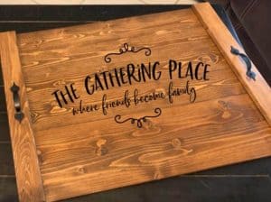 noodle board stove top cover saying the gathering place where friends become family
