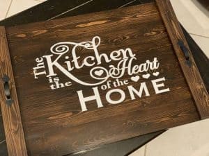 noodle board saying the kitchen is the heart of the home