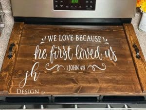 noodle board stove cover saying we love because he first loved us john 4 19