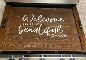 noodle board stove cover saying welcome to our beautiful chaos