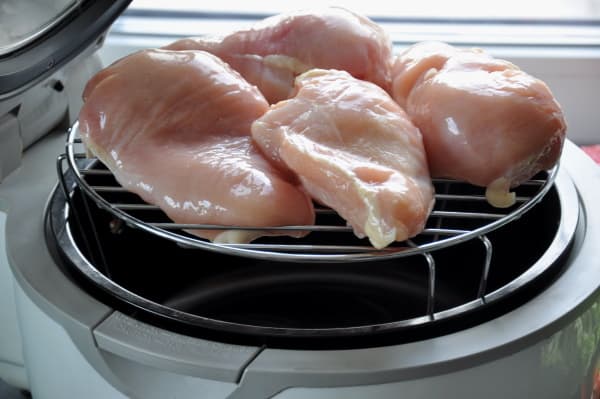 Stacked chicken breast, tenders or cutlets on air fryer rack