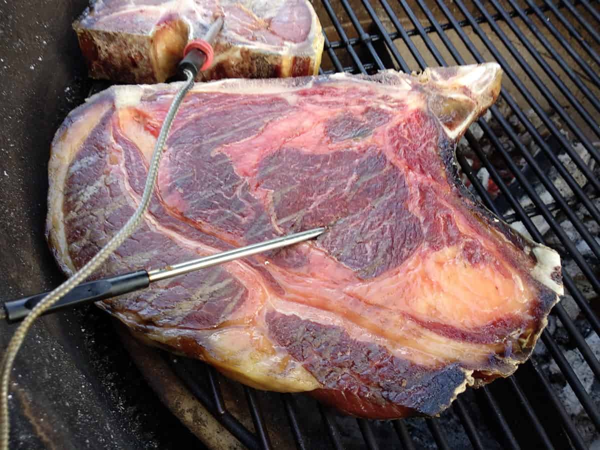 Rare steak on bbq grill with temp probe