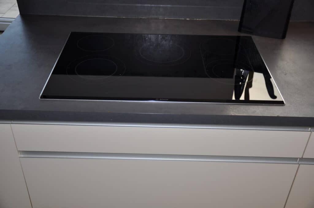 What do you put under an induction cooktop most people store these