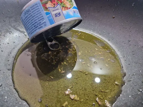 Easiest way to drain oil from canned tuna